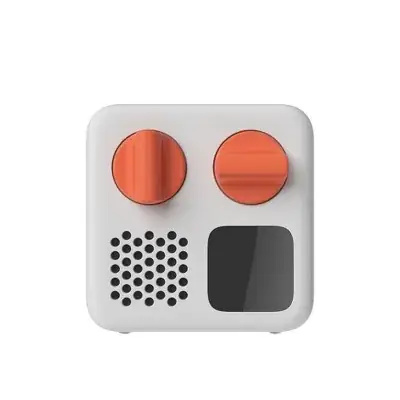 Yoto Mini 白色便携音频播放器，顶部有两个橙色旋钮